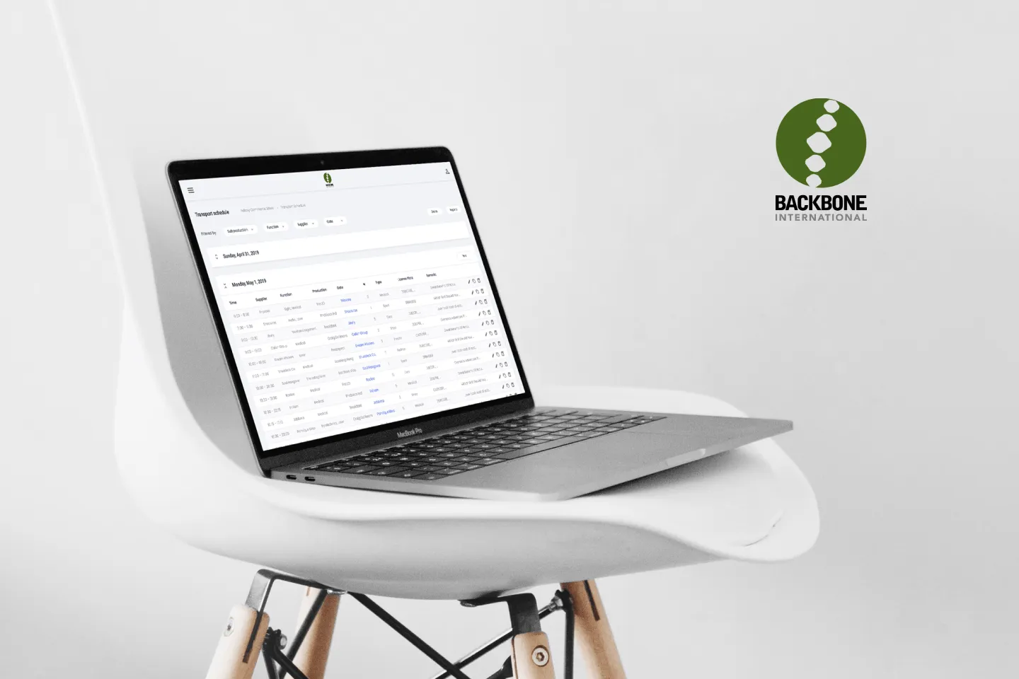Macbook on a chair presenting Backbone application interface