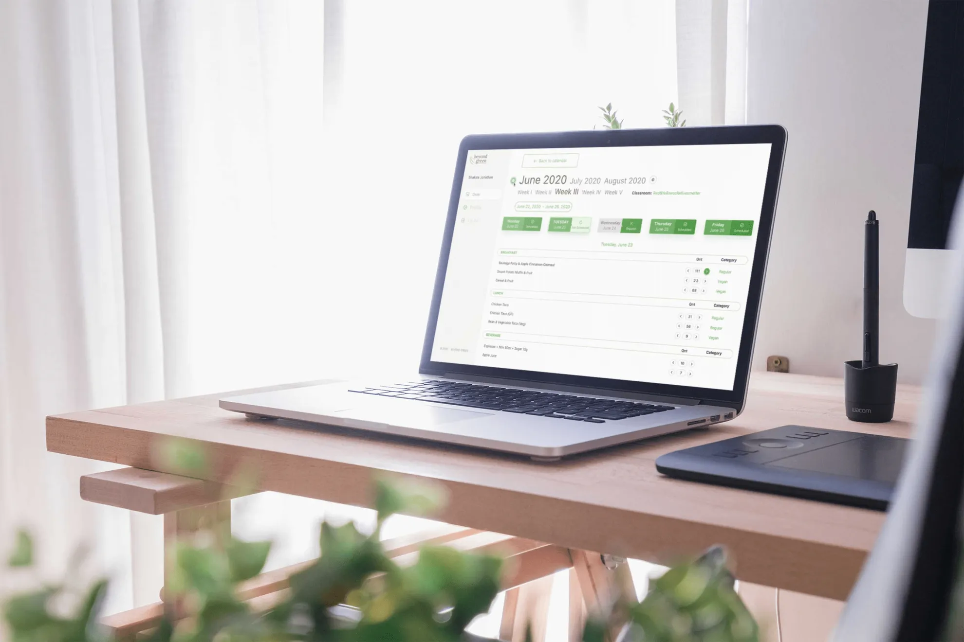 Laptop mockup displaying admin dashboard for school lunch management