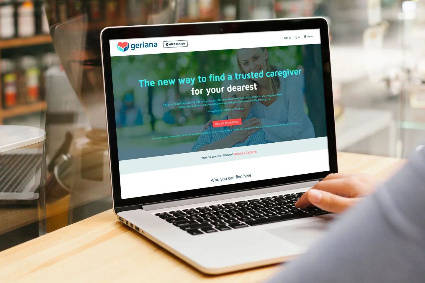 Notebook monitor displaying caregiving services tool featuring user signup and role selection