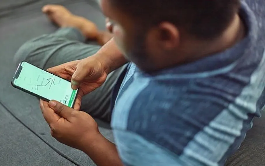 A man explores a mobile app with map on his iPhone
