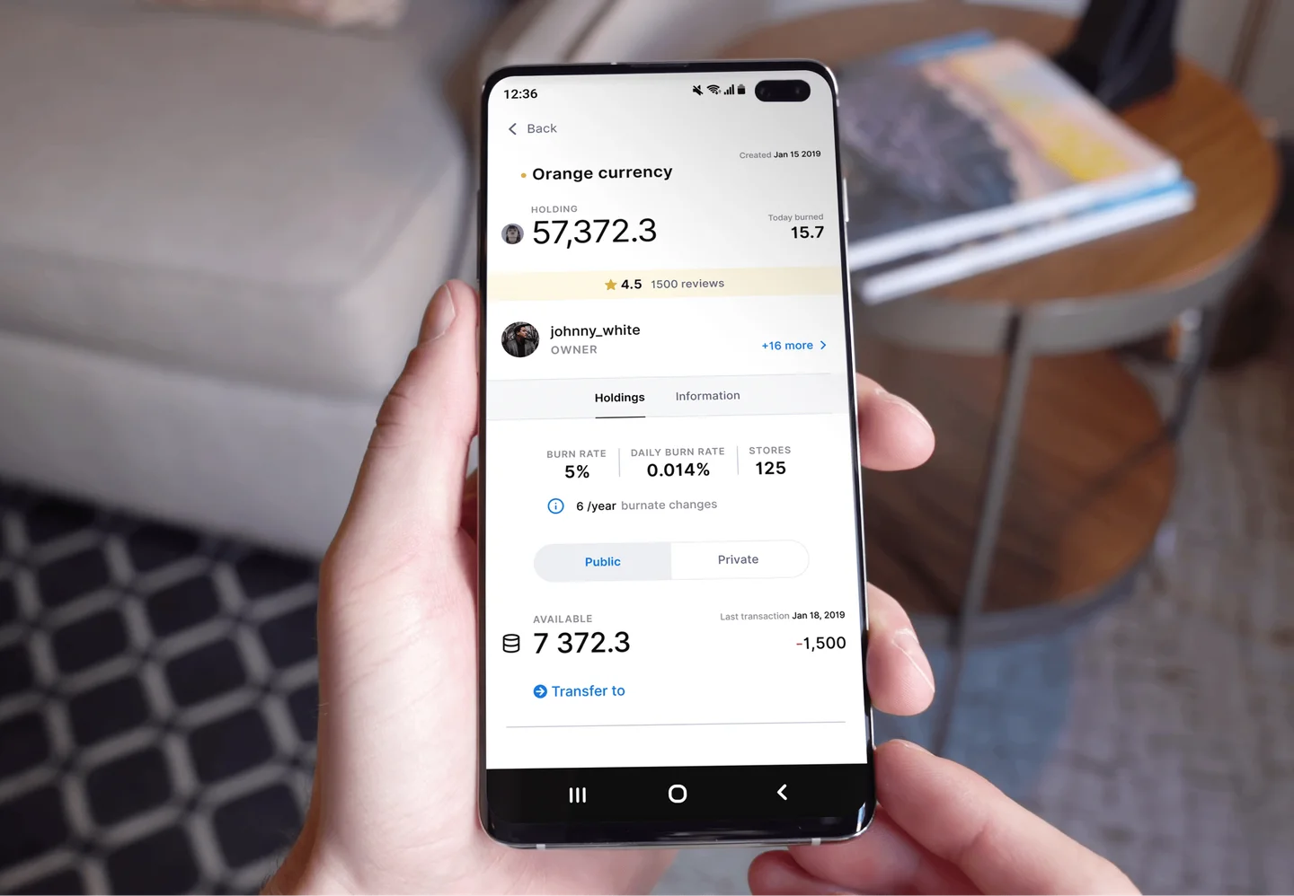 Phone demonstrating Orange Currency balance, burn amount, and last transaction