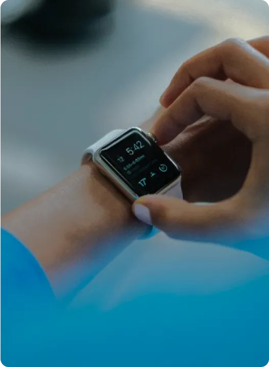 Smart watch on hand showing fitness app interface