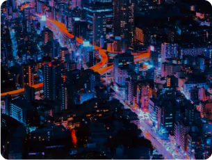 Vibrant nighttime aerial view of a dense cyberpunk city with glowing neon lights